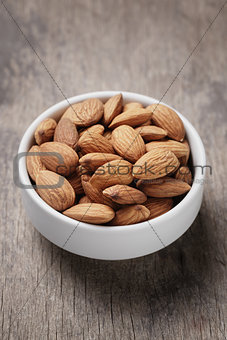 white bowl full of almonds