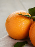 ripe oranges on wooden table
