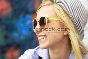Portrait of smiling young hipster outdoors