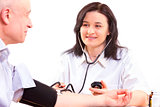 Doctor measuring  blood pressure  of senior man