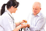 Doctor giving the medicine to a senior man