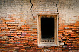 Detail of old weathered brick wall and window
