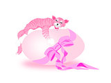 Pink cat asleep on large pink egg with bow