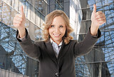 business woman thumbs up smiling
