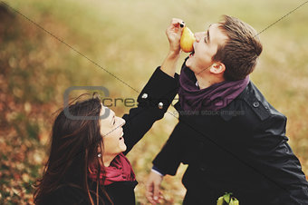 Young couple having date in autumn park.