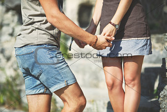 Hands of teen couple