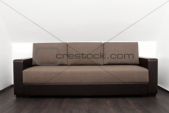 brown couch in bright white interior