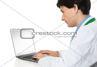 doctor using his laptop computer