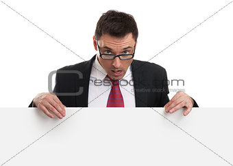 surprised business man showing blank empty white billboard sign