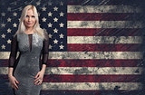 beautiful blonde woman over Grunge USA Flag background