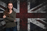 Beautiful girl over Grungy UK Flag background
