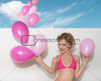 bikini woman with pink balloons 