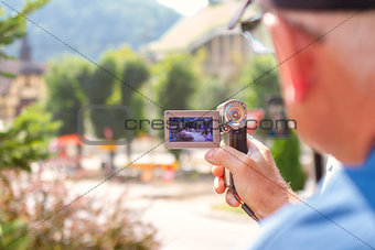 elderly man with video camera