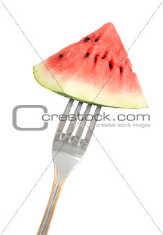 Slice of red watermelon on a fork