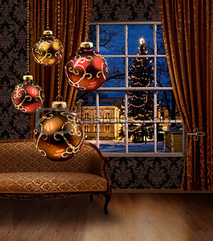 Christmas balls in room, town view window
