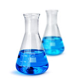 Two labotatory glass beakers with liquid samples