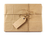 Brown mail delivery package with tag