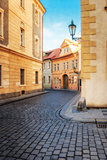Old city without people . Prague. textured old paper background