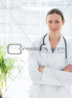 Confident doctor with arms crossed