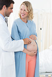 Pregnant woman being checked by doctor