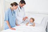 Doctors attending little girl