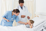 Doctors examining sick girl