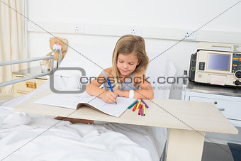 Sick girl coloring book in hospital