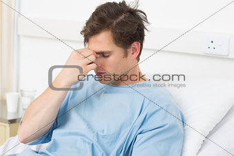 Patient suffering from headache relaxing in hospital