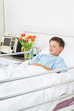 Boy resting in hospital ward