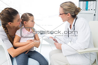 Mother and daughter visiting doctor