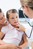 Girl being examined by pediatrician