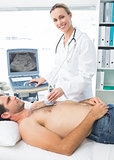 Doctor using sonogram on male patient