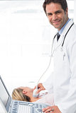 Doctor using sonogram on neck of patient