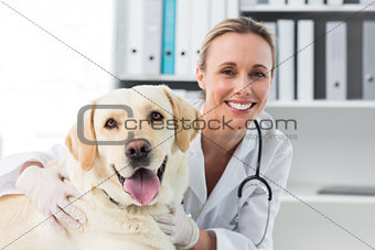 Confident female veterinarian with dog