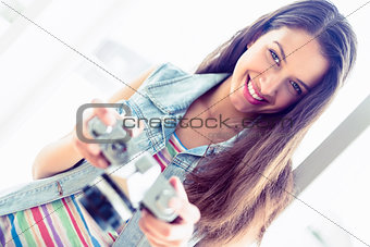 Cheerful brunette holding her camera
