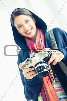 Attractive brunette holding her camera
