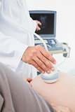 Pregnant woman having a sonagram scan