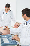 Excited pregnant woman having a sonogram scan