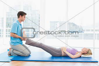 Peaceful pregnant woman getting a relaxing massage
