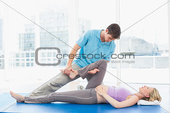 Blonde pregnant woman getting a relaxing massage
