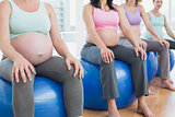 Pregnant women sitting on exercise balls