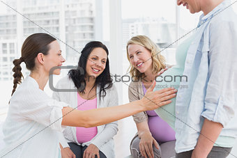 Happy pregnant women at antenatal class