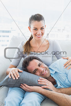Happy couple relaxing on the couch together