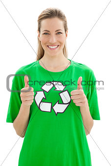 Woman in recycling symbol t-shirt gesturing thumbs up