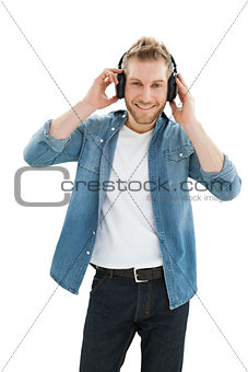 Portrait of a young man enjoying music