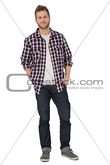 Portrait of a young man with hands in pockets