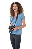 Portrait of a cheerful female photographer