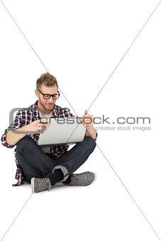 Full length of a young man with laptop