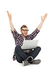 Cheerful young man with laptop raising hands