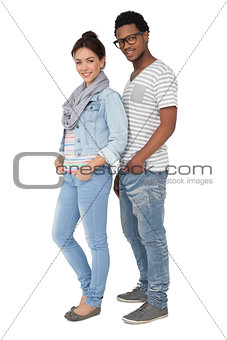 Full length portrait of a smiling cool couple